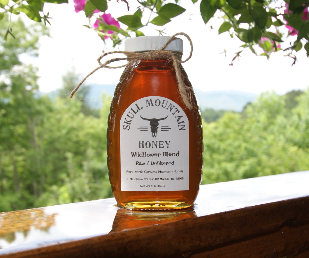 One pound of wildflower honey in a classic old school jar with plastic twist off lid.