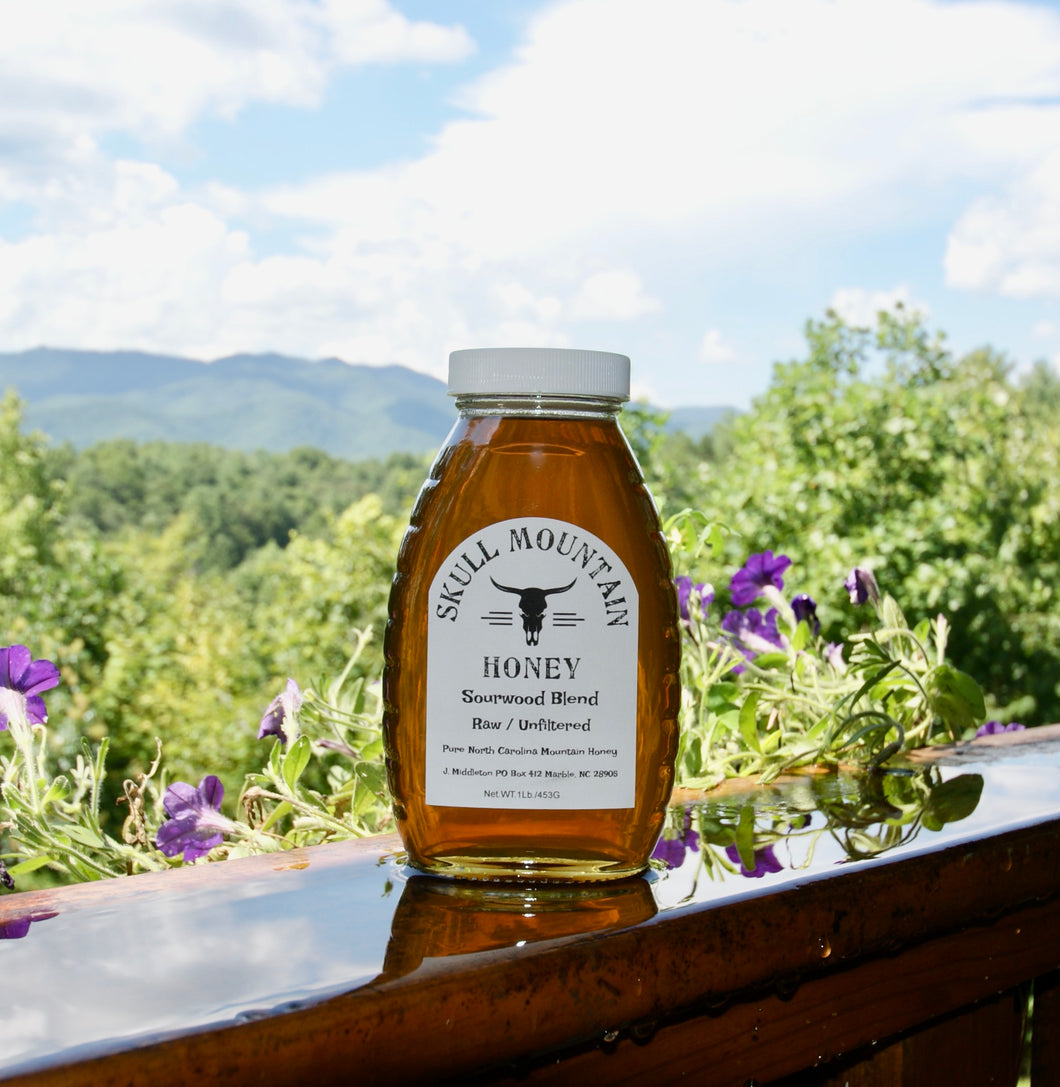 One pound of Sourwood honey in an old school honey jar.